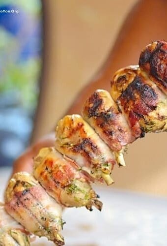 chicken churraco in a long skewer