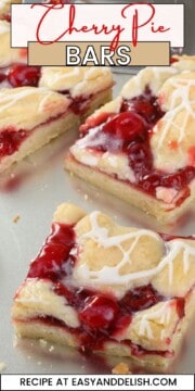 Close up of cherry pie bars on a baking sheet.
