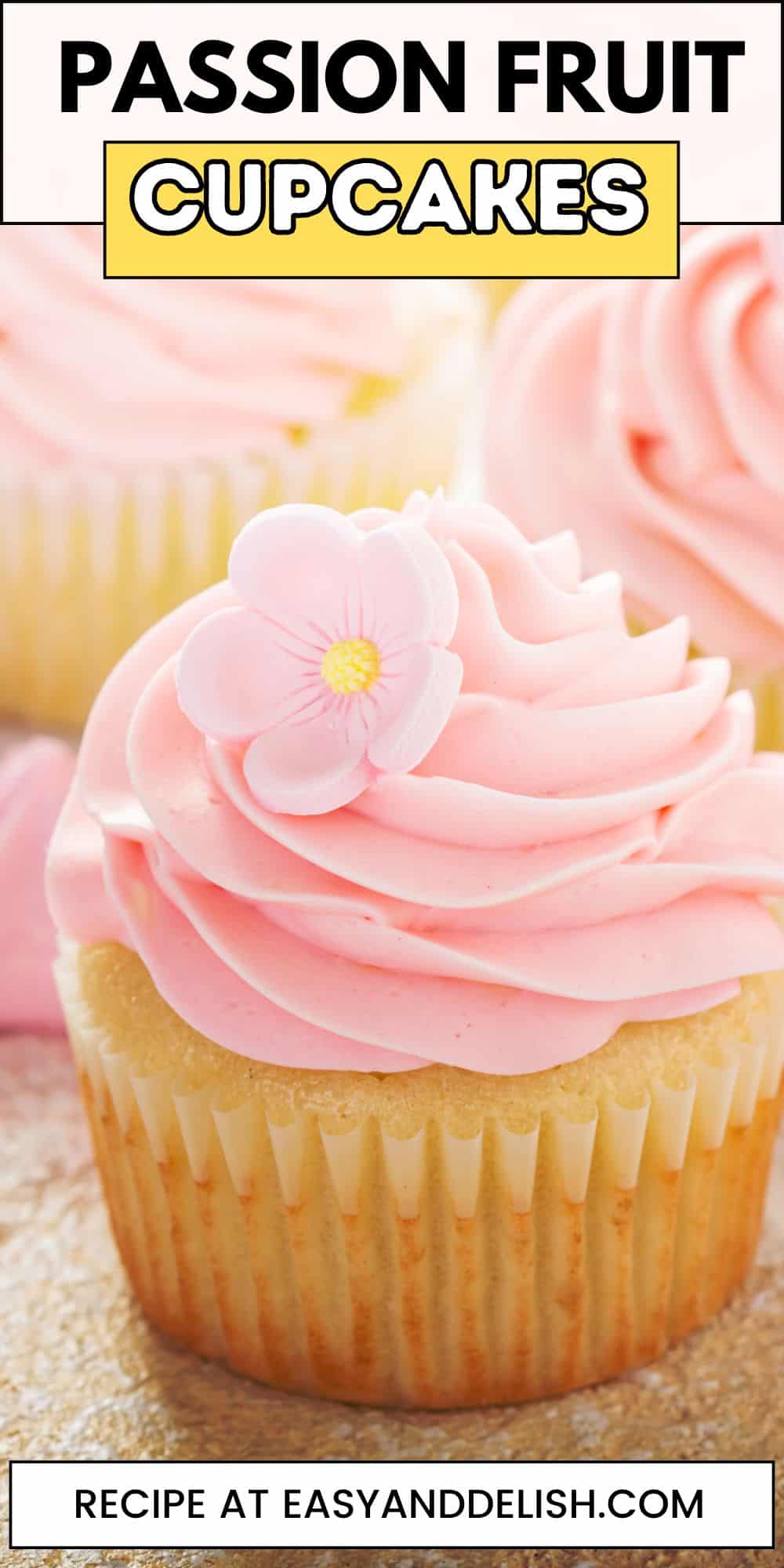 Pin showing close up of a passion fruit cupcake with pink frosting.