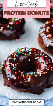 Pin showing several low-carb protein donuts on a parchment paper.