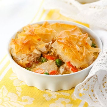 Chicken pot pie with phylllo dough in a baking dish on a table.