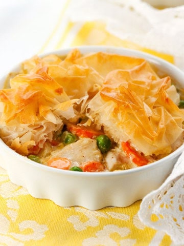 Chicken pot pie with phylllo dough in a baking dish on a table.