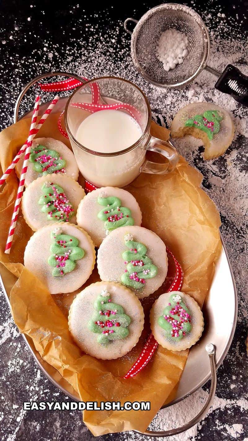 coconut sugar cookies in a platter with a cup of milk