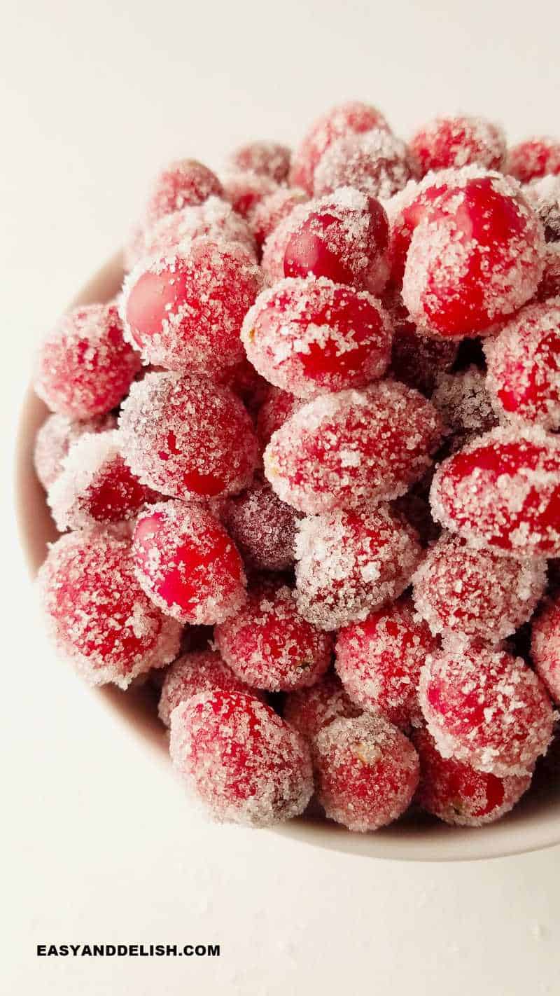 close up of sugared cranberries in a bowl